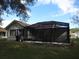 Rear view of the house, highlighting the screened patio at 11540 Sandy Hill Dr, Orlando, FL 32821