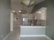 Modern kitchen boasts white cabinets and breakfast bar at 11540 Sandy Hill Dr, Orlando, FL 32821