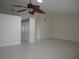 Spacious living room featuring tile floors and ceiling fan at 11540 Sandy Hill Dr, Orlando, FL 32821
