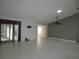 Bright and airy living room with tile floors and ceiling fan at 11540 Sandy Hill Dr, Orlando, FL 32821