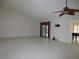 Large living area with tile floors and sliding glass doors at 11540 Sandy Hill Dr, Orlando, FL 32821