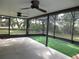 Covered patio with ceiling fans and artificial turf at 11540 Sandy Hill Dr, Orlando, FL 32821