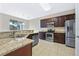 Kitchen with granite countertops and stainless steel appliances at 612 Terrace Spring Dr, Orlando, FL 32828