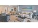 Living room featuring a comfy off-white sofa and coffee table at 2924 Waterlily Way, Poinciana, FL 34759