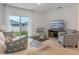 Spacious living room with a view of the backyard and plenty of natural light at 2924 Waterlily Way, Poinciana, FL 34759