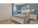 Bedroom with white bed frame and patterned bedding at 2924 Waterlily Way, Poinciana, FL 34759