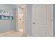 Shower stall with patterned curtain and built-in shelving at 2924 Waterlily Way, Poinciana, FL 34759