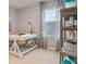 Home office with built-in shelving and large window at 2924 Waterlily Way, Poinciana, FL 34759