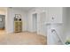 Upstairs hallway with linen closet and carpet flooring at 2924 Waterlily Way, Poinciana, FL 34759