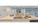 Kitchen with island, double sink, and view into dining and living areas at 2924 Waterlily Way, Poinciana, FL 34759
