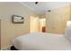 Comfortable bedroom with queen-size bed and en-suite bathroom at 1100 Sunset View Cir # 203, Reunion, FL 34747