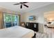 Spacious bedroom with king-size bed and access to balcony at 1100 Sunset View Cir # 203, Reunion, FL 34747