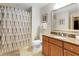 Simple bathroom with shower and updated vanity at 1100 Sunset View Cir # 203, Reunion, FL 34747