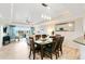 Open dining area with view into living room and balcony at 1100 Sunset View Cir # 203, Reunion, FL 34747