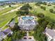 Community clubhouse and pool with surrounding golf course at 1100 Sunset View Cir # 203, Reunion, FL 34747