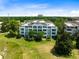 Luxury condo building with resort-style amenities and golf course views at 1100 Sunset View Cir # 203, Reunion, FL 34747