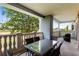 Private balcony with table and chairs, offering a view at 1100 Sunset View Cir # 203, Reunion, FL 34747