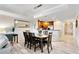 Bright dining area featuring a wood table and chairs at 1100 Sunset View Cir # 203, Reunion, FL 34747