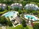 Community pool and surrounding buildings at 1100 Sunset View Cir # 203, Reunion, FL 34747