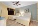 Guest bedroom with two twin beds and plenty of natural light at 1100 Sunset View Cir # 203, Reunion, FL 34747