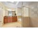 Elegant bathroom with double vanity, soaking tub, and walk-in shower at 1100 Sunset View Cir # 203, Reunion, FL 34747