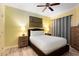 Bright bedroom with queen-size bed and ample closet space at 1100 Sunset View Cir # 203, Reunion, FL 34747