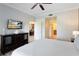 Main bedroom with king bed and view of dining area at 1100 Sunset View Cir # 203, Reunion, FL 34747