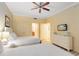Guest bedroom with two twin beds and built-in dresser at 1100 Sunset View Cir # 203, Reunion, FL 34747