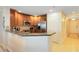 Modern kitchen featuring wood cabinets and granite countertops at 1100 Sunset View Cir # 203, Reunion, FL 34747