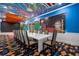 Hollywood-themed dining room with long white table at 1021 Fantasy Dr, Davenport, FL 33896