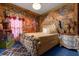 Thematic bedroom with ornate bed and painted mural at 1021 Fantasy Dr, Davenport, FL 33896