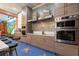 Modern kitchen with stainless steel appliances and unique Hollywood theme at 1021 Fantasy Dr, Davenport, FL 33896