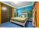 Serene bedroom featuring a jungle-themed mural and white bed frame at 1021 Fantasy Dr, Davenport, FL 33896