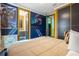 Modern bedroom with a sci-fi mural and ensuite bathroom at 1021 Fantasy Dr, Davenport, FL 33896