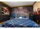 Bedroom with a round bed and a boxing-themed mural at 1021 Fantasy Dr, Davenport, FL 33896