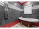 Bathroom with a clawfoot tub and a rainfall shower head at 1021 Fantasy Dr, Davenport, FL 33896