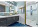 Modern bathroom with dual sinks and a large walk-in shower at 1021 Fantasy Dr, Davenport, FL 33896