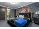 Stylish bedroom with ensuite bathroom access and a mural wall at 1021 Fantasy Dr, Davenport, FL 33896