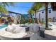 Outdoor fire pit lounge area with pool views at 1021 Fantasy Dr, Davenport, FL 33896