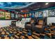 Home theater with plush seating and movie posters at 1021 Fantasy Dr, Davenport, FL 33896