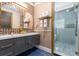Elegant bathroom with double vanity, large shower, and mosaic tile at 1021 Fantasy Dr, Davenport, FL 33896