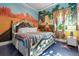 Bedroom with a large bed and Route 66 themed wall mural at 1021 Fantasy Dr, Davenport, FL 33896