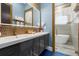 Modern bathroom with double vanity and a frameless glass shower at 1021 Fantasy Dr, Davenport, FL 33896