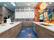 Large kitchen island, stainless steel appliances, and a Hollywood-themed backsplash at 1021 Fantasy Dr, Davenport, FL 33896