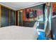 Spacious bedroom with large bed, custom mural, and ample closet space at 1021 Fantasy Dr, Davenport, FL 33896