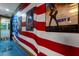 Hallway with an American flag mural and movie posters at 1021 Fantasy Dr, Davenport, FL 33896