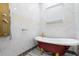 Luxury bathroom with freestanding tub and gold accents at 1021 Fantasy Dr, Davenport, FL 33896