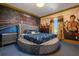 Round bed in a themed bedroom with murals and unique decor at 1021 Fantasy Dr, Davenport, FL 33896