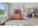 Open living area with TV and view into dining area at 7164 Painted Bunting, St Cloud, FL 34773