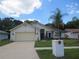 House exterior with a palm tree and American flag at 11540 Sandy Hill Dr, Orlando, FL 32821